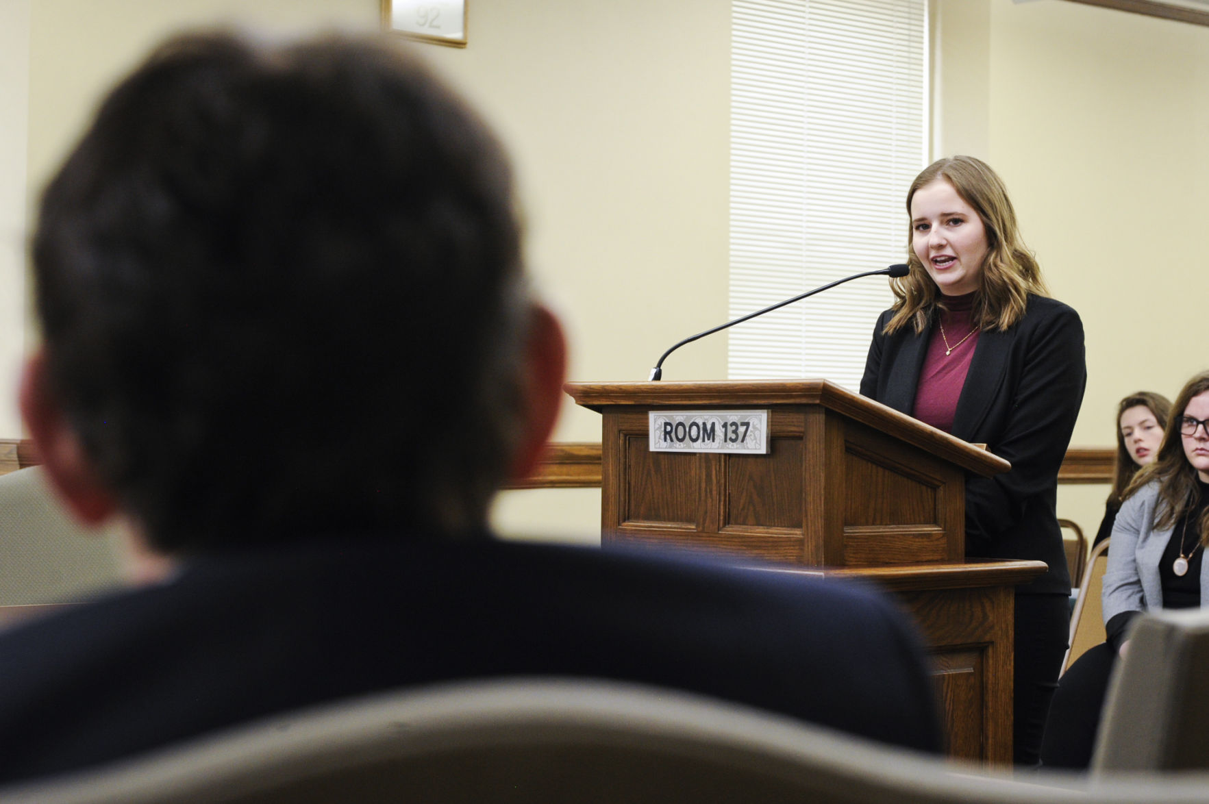 High school student Amanda Penley, right, responds to a question from
